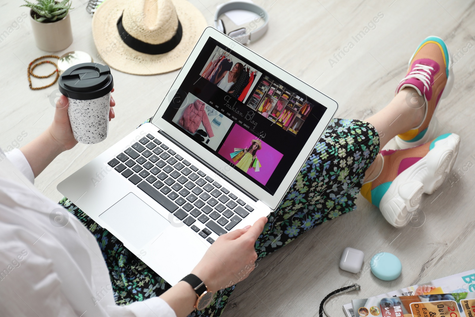 Photo of Fashion blogger with laptop on floor, closeup