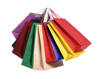 Photo of Colorful paper shopping bags isolated on white