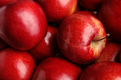 Many ripe juicy red apples as background, closeup