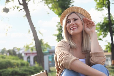 Photo of Portrait of beautiful woman in straw hat outdoors on sunny day