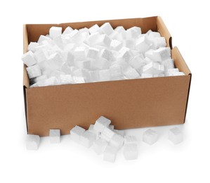 Photo of Cardboard box with styrofoam cubes on white background