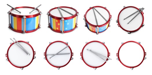 Image of Bright toy drums and sticks on white background, set