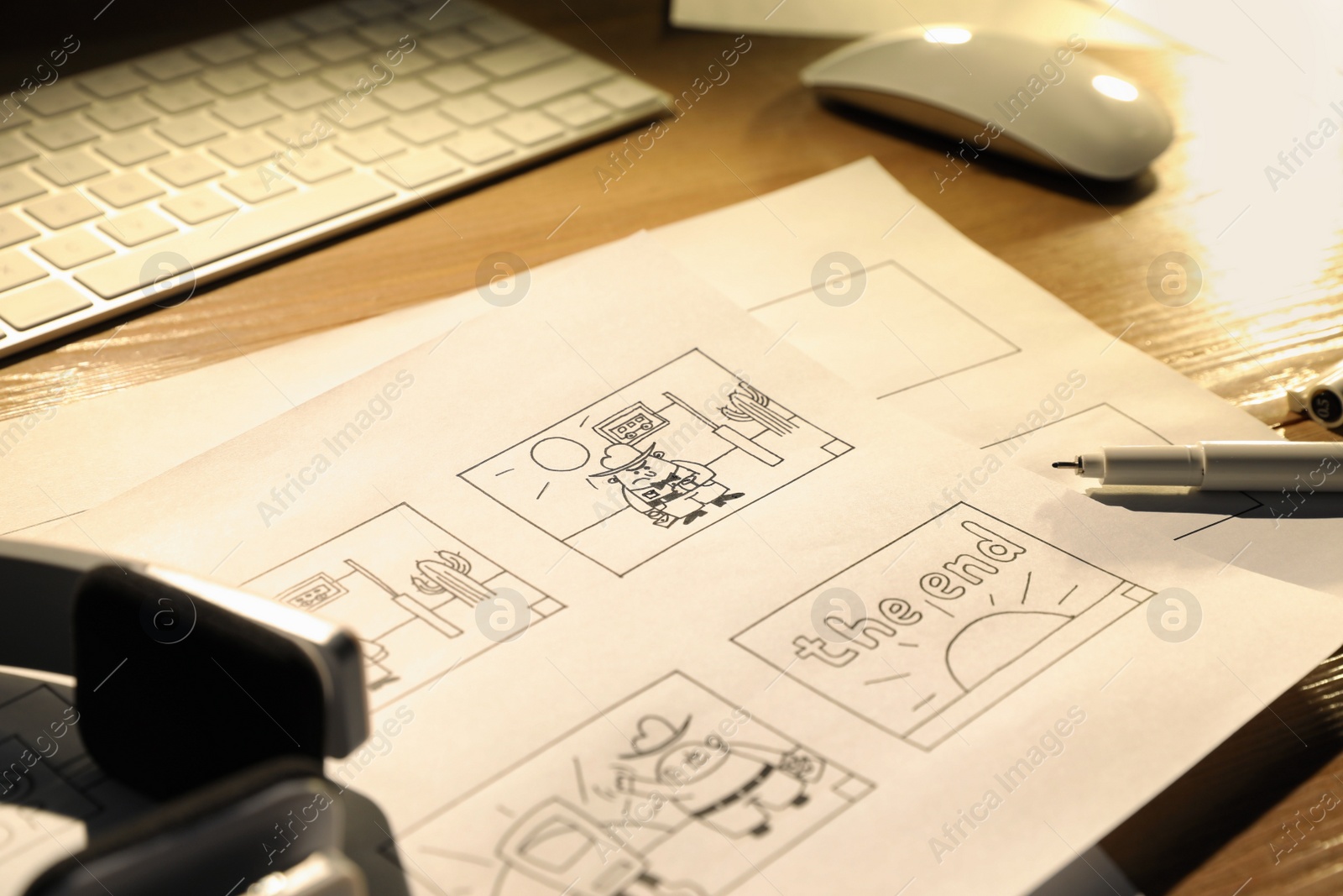 Photo of Storyboard with cartoon sketches at workplace. 	
Pre-production process