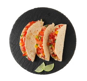 Photo of Delicious tacos with vegetables and slices of lime isolated on white, top view