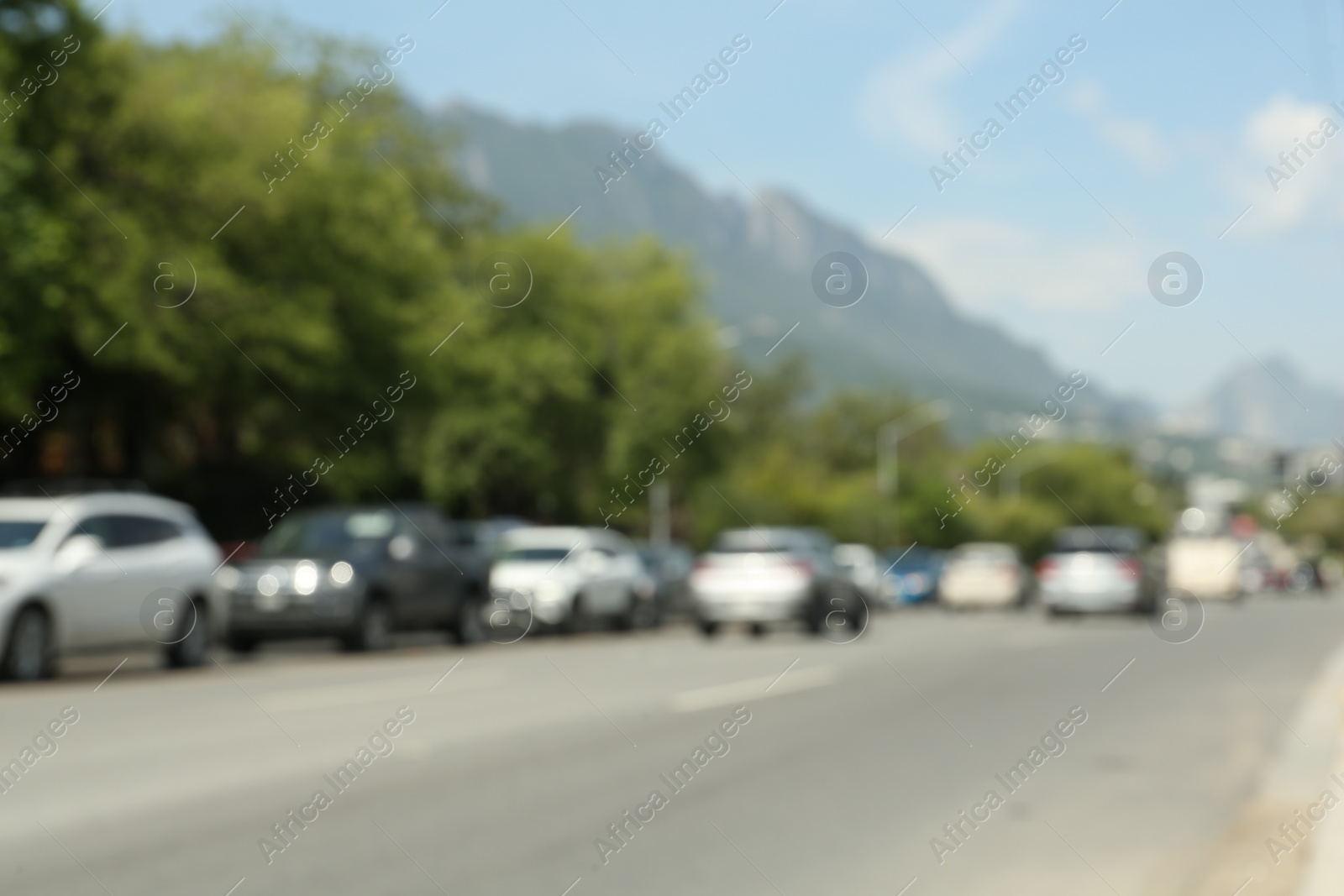 Photo of Blurred view of mountains and highway with cars