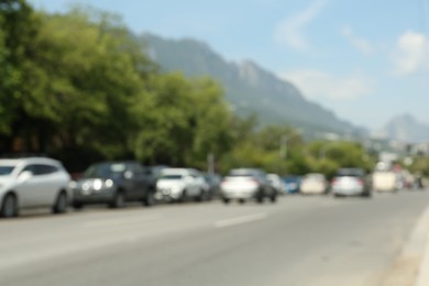Photo of Blurred view of mountains and highway with cars