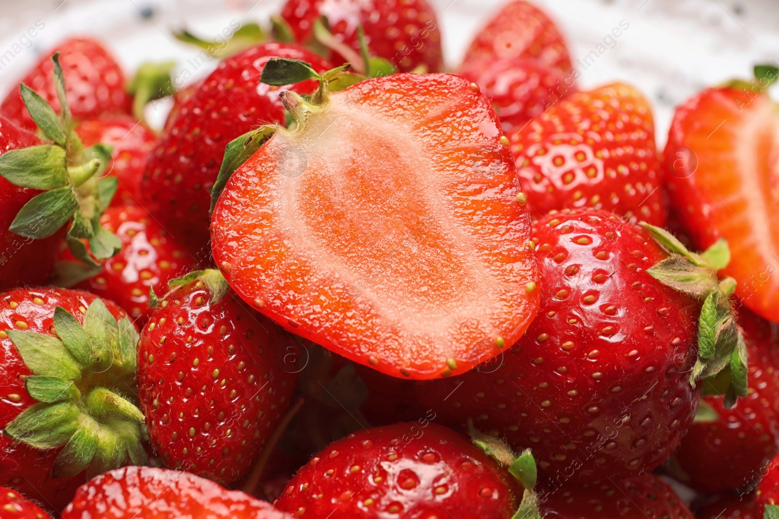 Photo of Heap of ripe red strawberries, closeup view