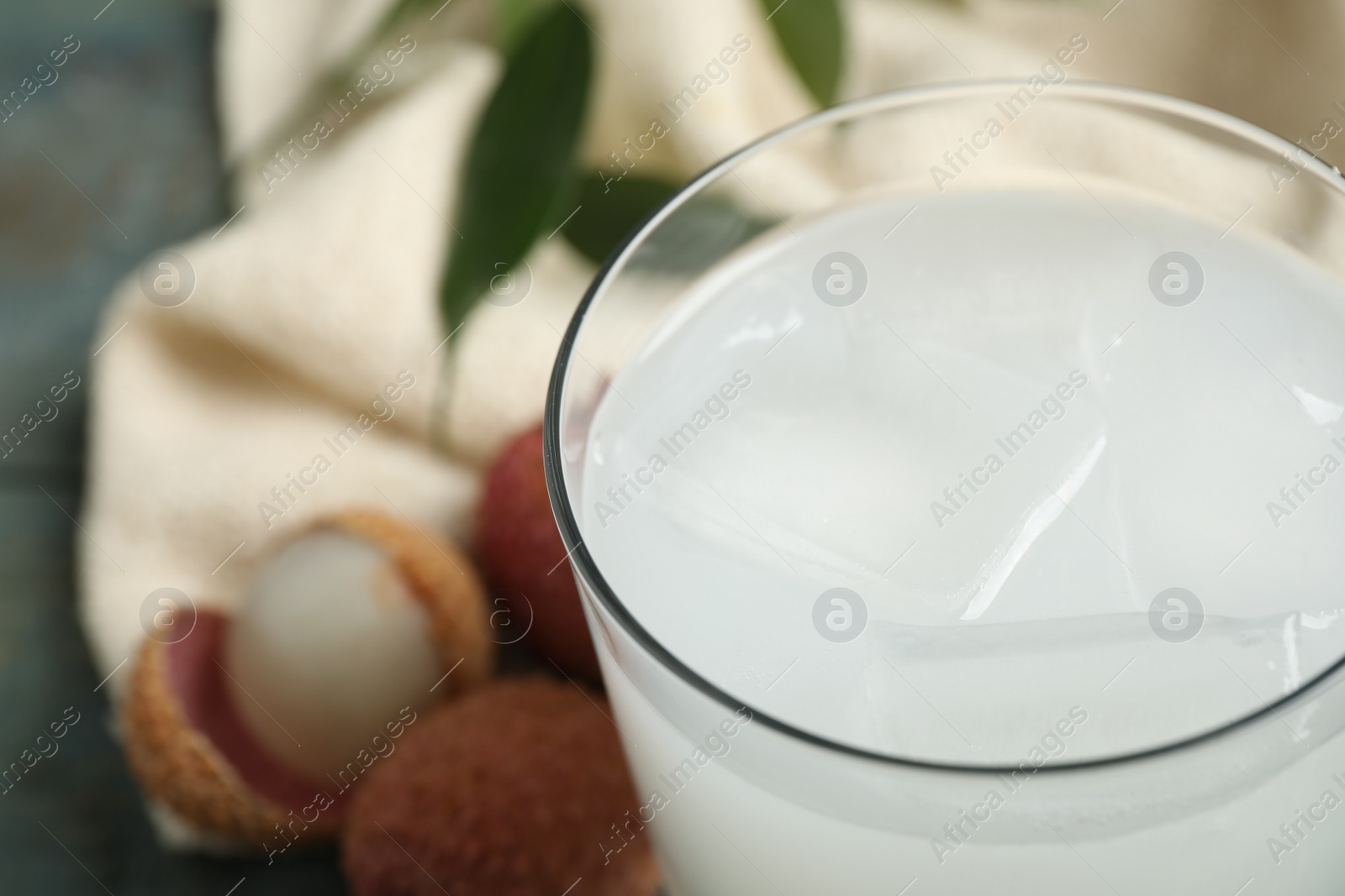 Photo of Freshly made lychee juice on table, closeup. space for text