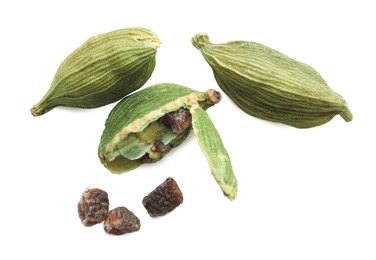Pile of dry green cardamom pods on white background, top view
