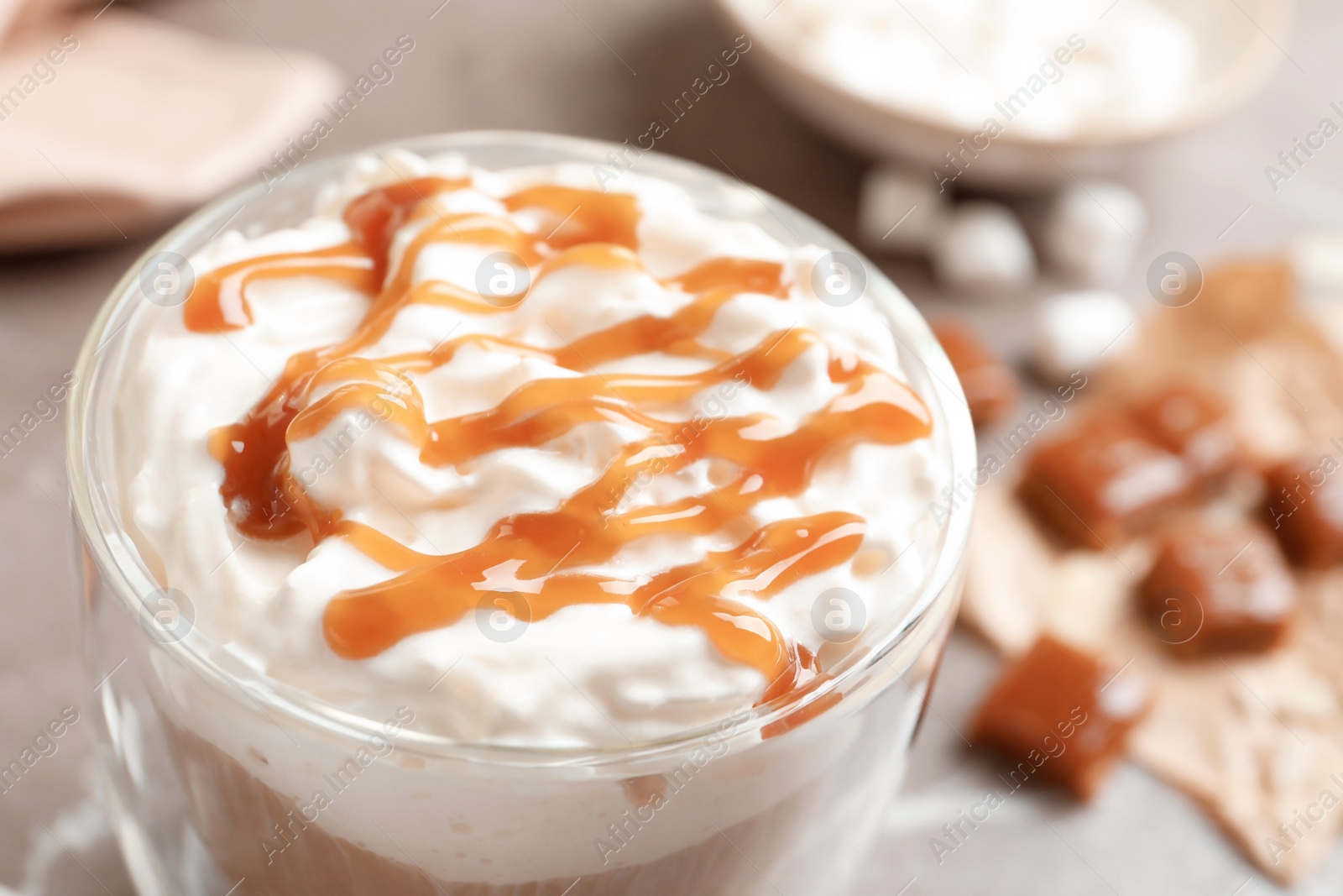 Photo of Cup of coffee with caramel topping, closeup