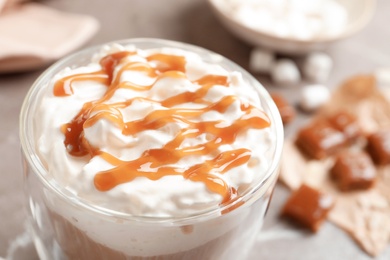 Photo of Cup of coffee with caramel topping, closeup