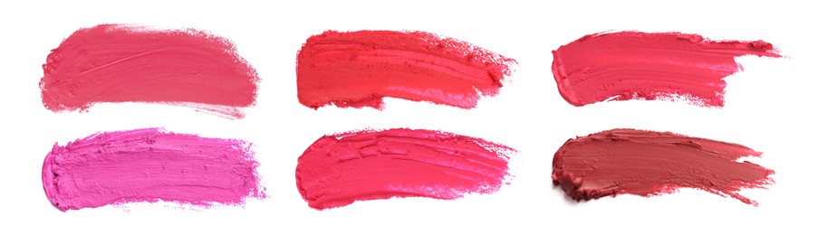 Image of Smears of different beautiful lipsticks on white background, top view. Banner design