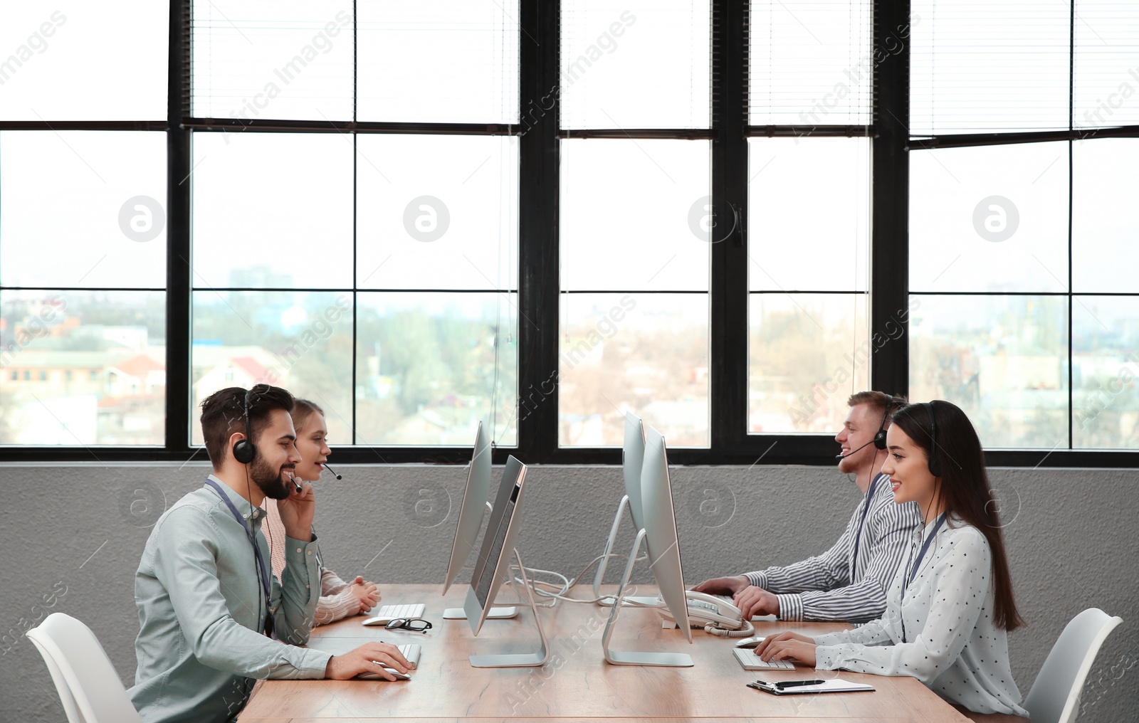 Photo of Technical support operators working in modern office