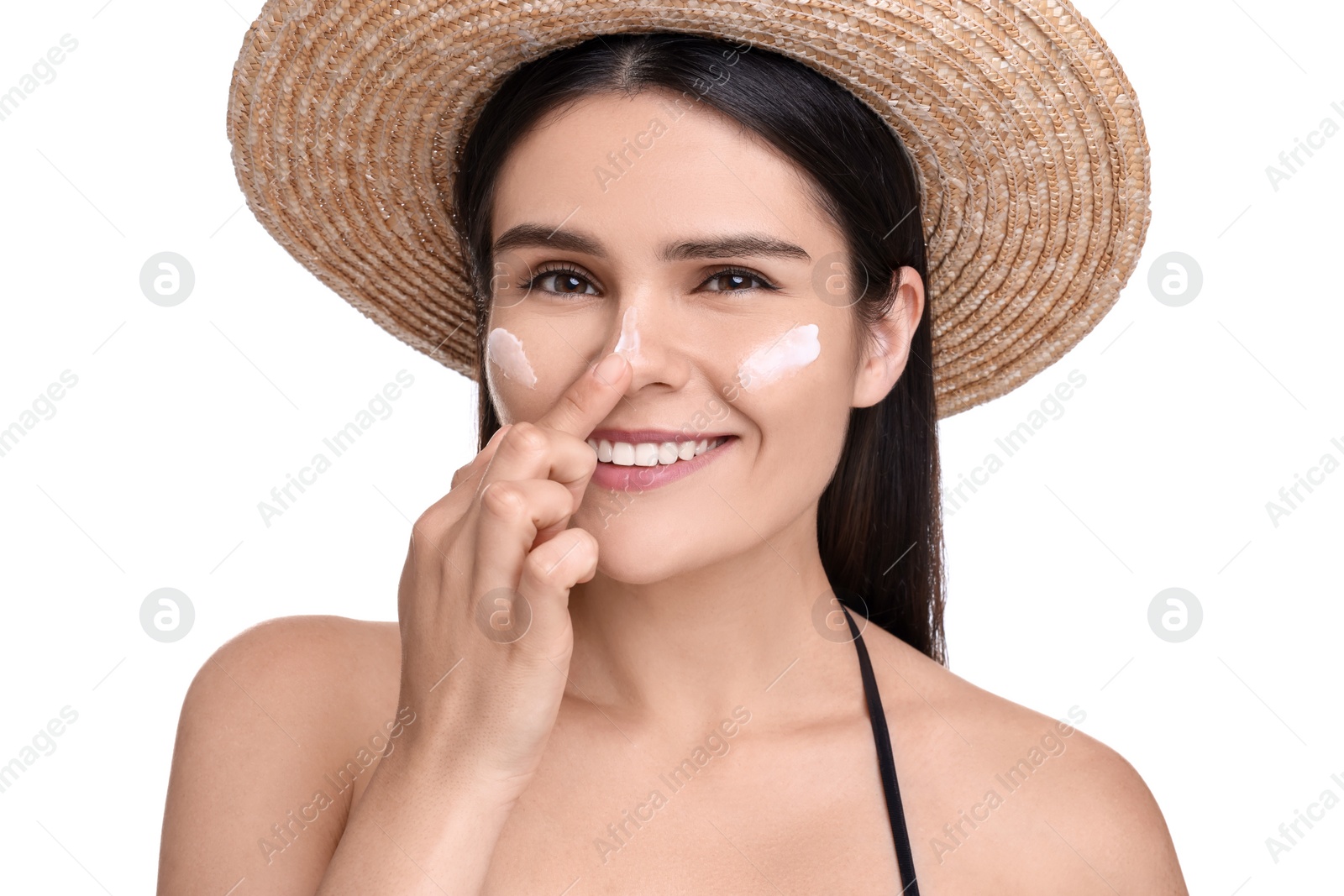 Photo of Beautiful young woman with sun protection cream on her face against white background