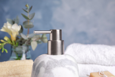 Photo of Modern marble soap dispenser in bathroom, closeup