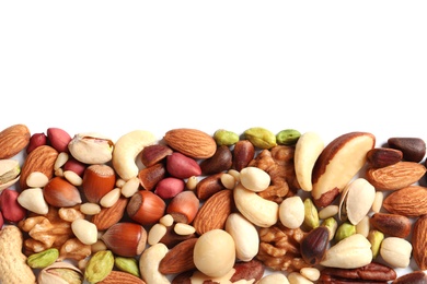 Photo of Mixed organic nuts on white background, top view. Space for text