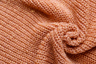 Photo of Brown knitted fabric as background, closeup view