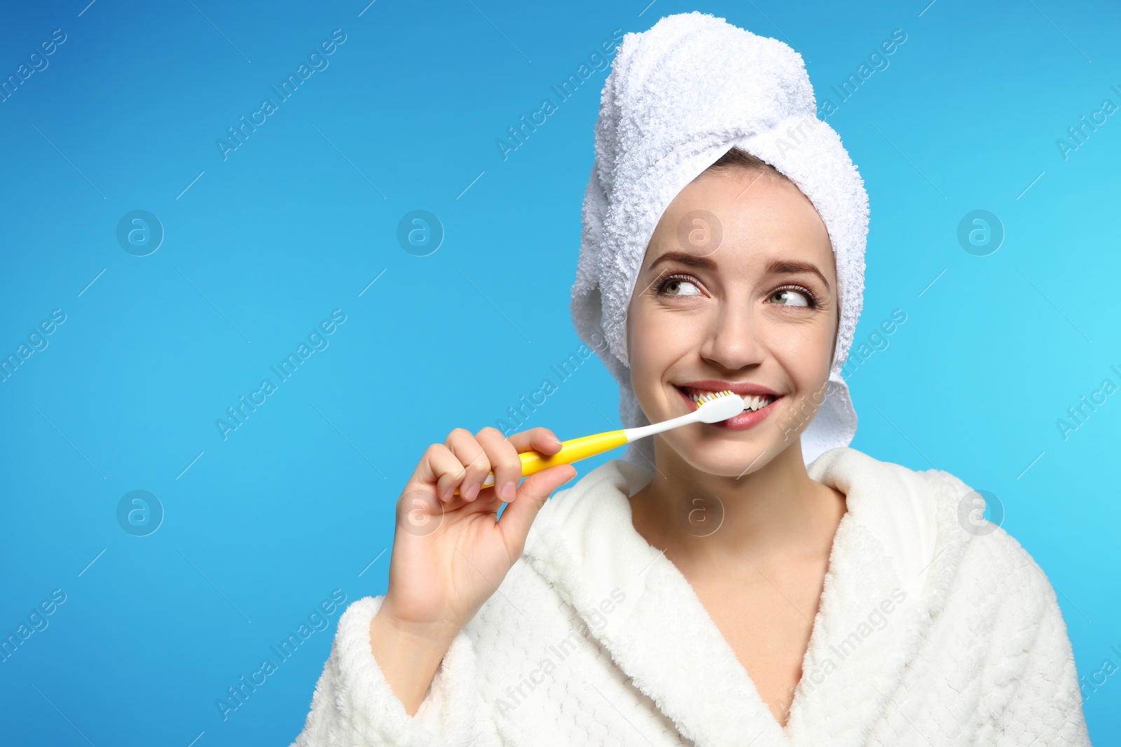 Photo of Portrait of young woman with toothbrush on color background. Space for text