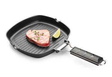 Delicious tuna steak with lime in grill pan on white background