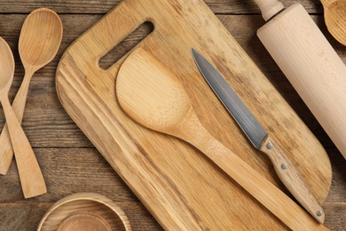 Cooking utensils on wooden table, flat lay