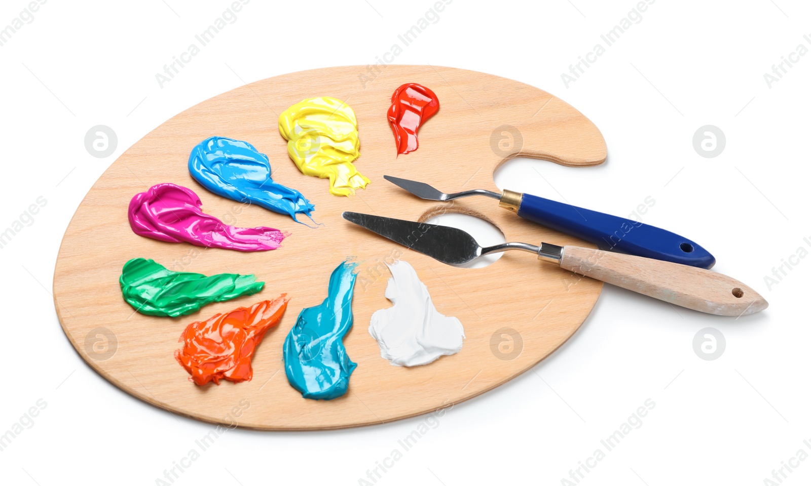 Photo of Palette with paints and spatulas on white background. Artist equipment
