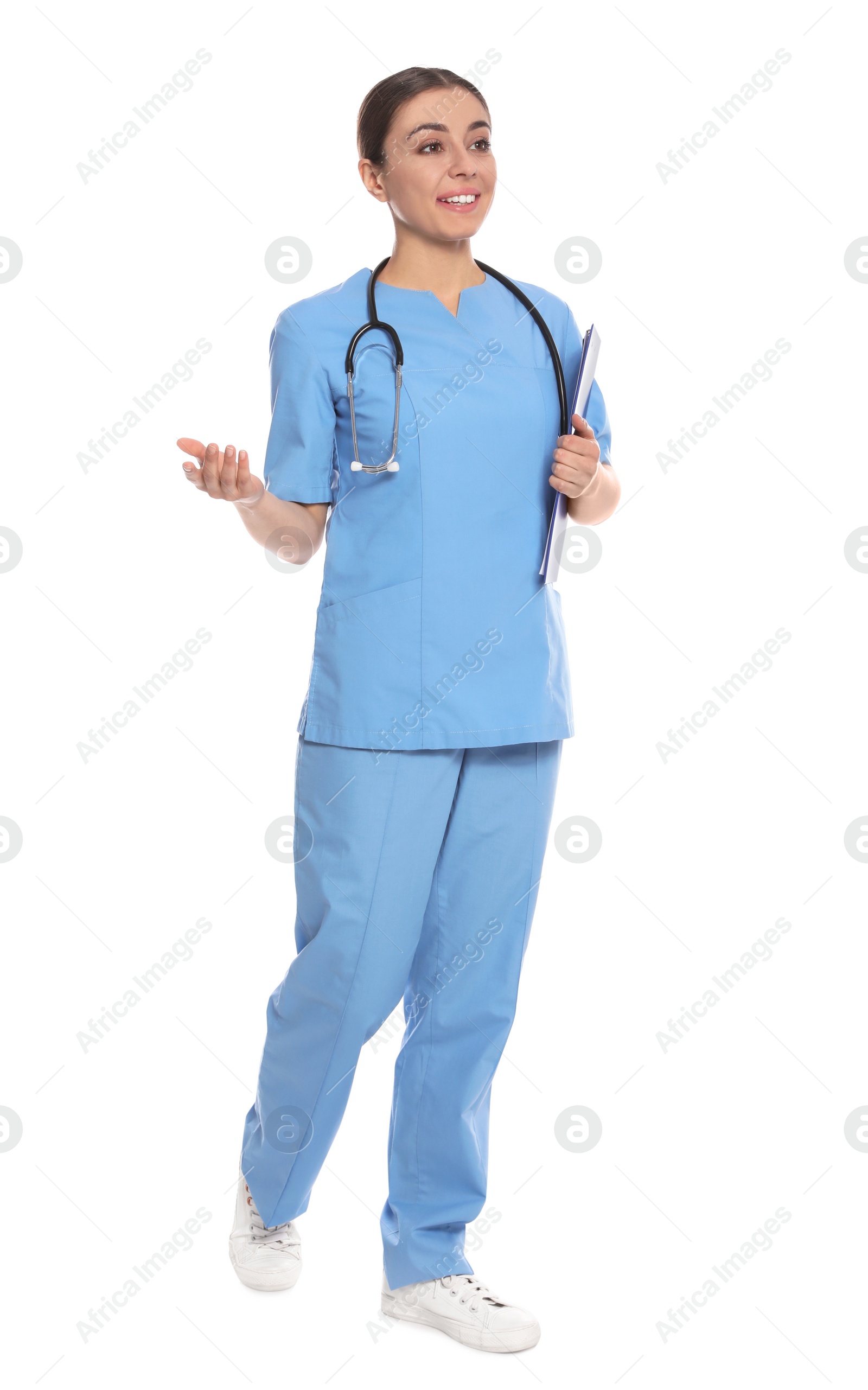 Photo of Full length portrait of medical doctor with clipboard and stethoscope isolated on white