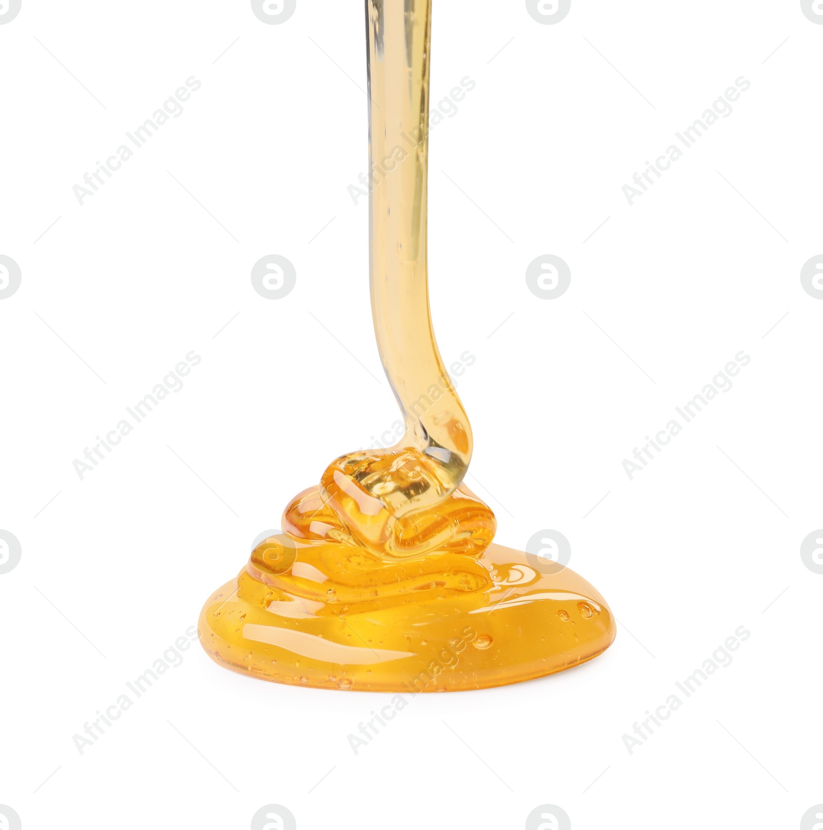 Photo of Pouring tasty natural honey isolated on white