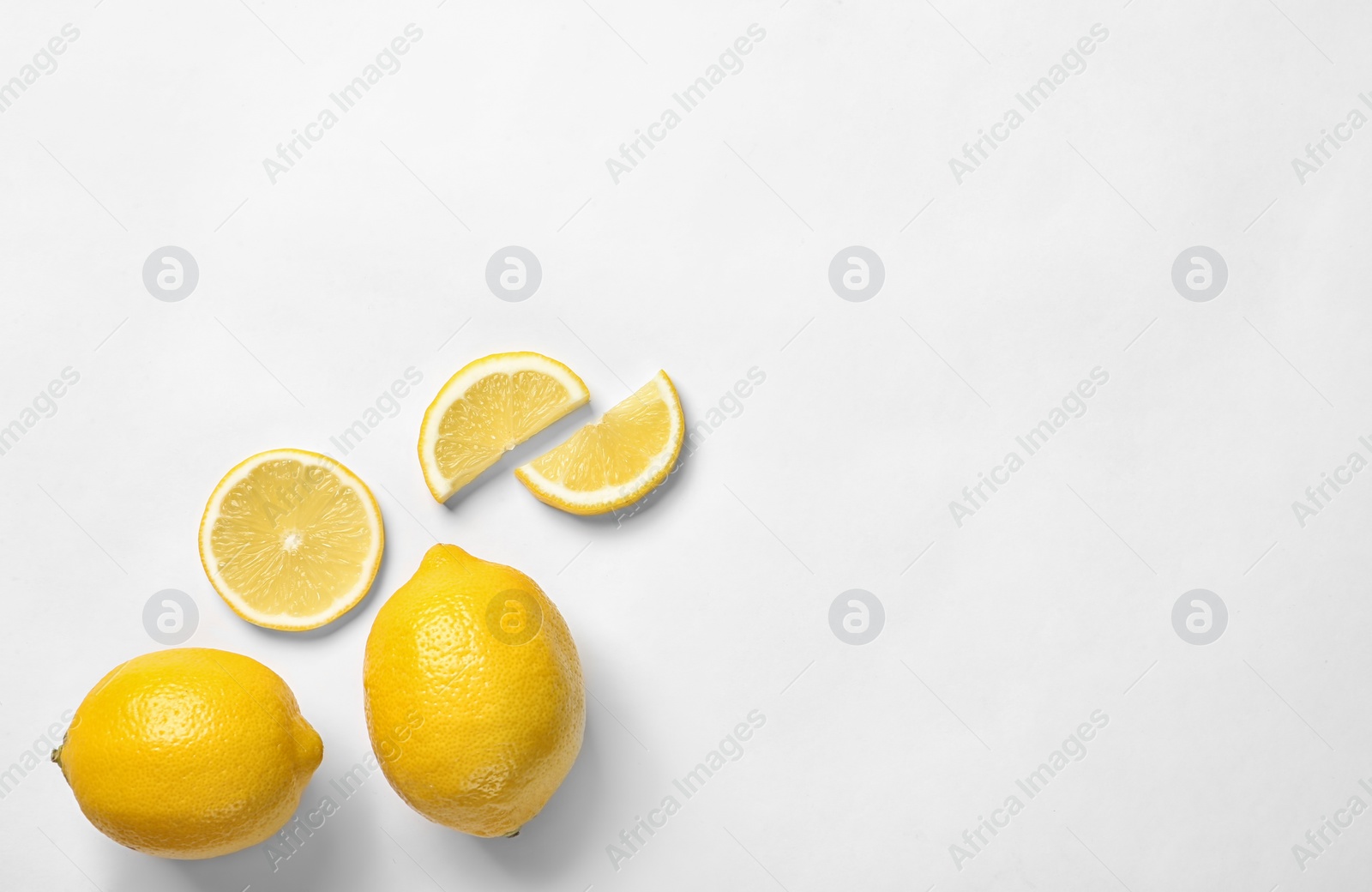 Photo of Beautiful composition with lemons on white background