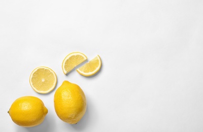 Photo of Beautiful composition with lemons on white background