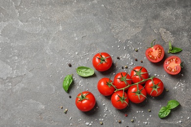 Flat lay composition with cherry tomatoes on stone background. Space for text