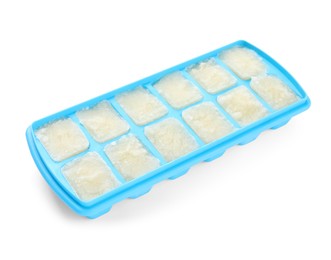 Photo of Cauliflower puree in ice cube tray isolated on white