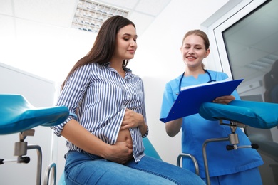 Pregnant woman having appointment at gynecologist office