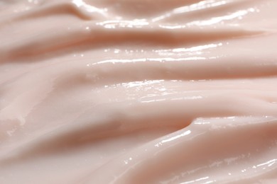 Photo of Texture of face cream as background, closeup view