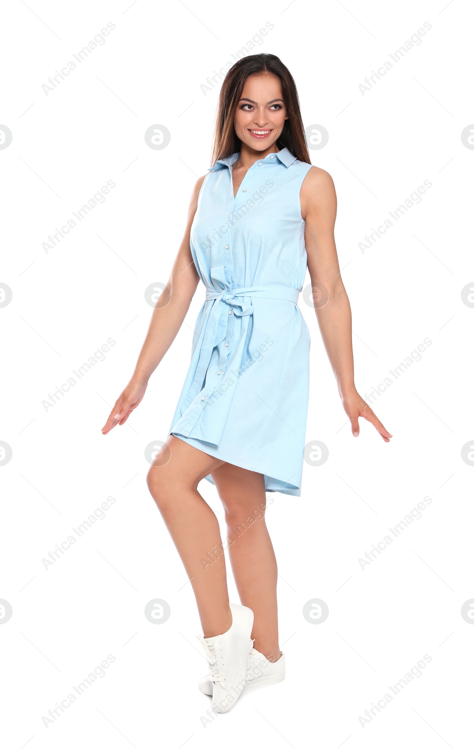 Photo of Full length portrait of beautiful young woman in dress on white background