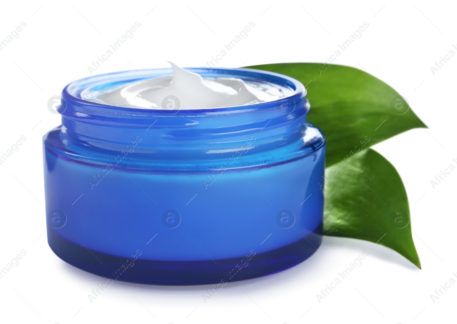 Photo of Jar of organic cream and leaves isolated on white