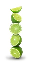 Image of Many stacked cut limes on white background