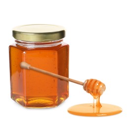 Natural honey dripping from dipper. Jar full of honey on white background