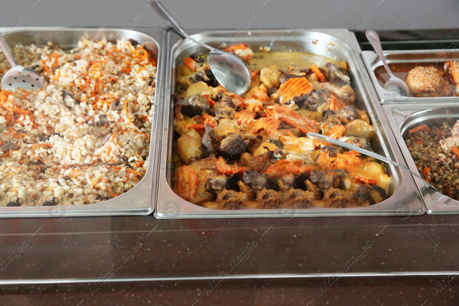 Photo of Containers with healthy food in school canteen