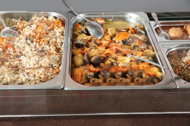 Containers with healthy food in school canteen