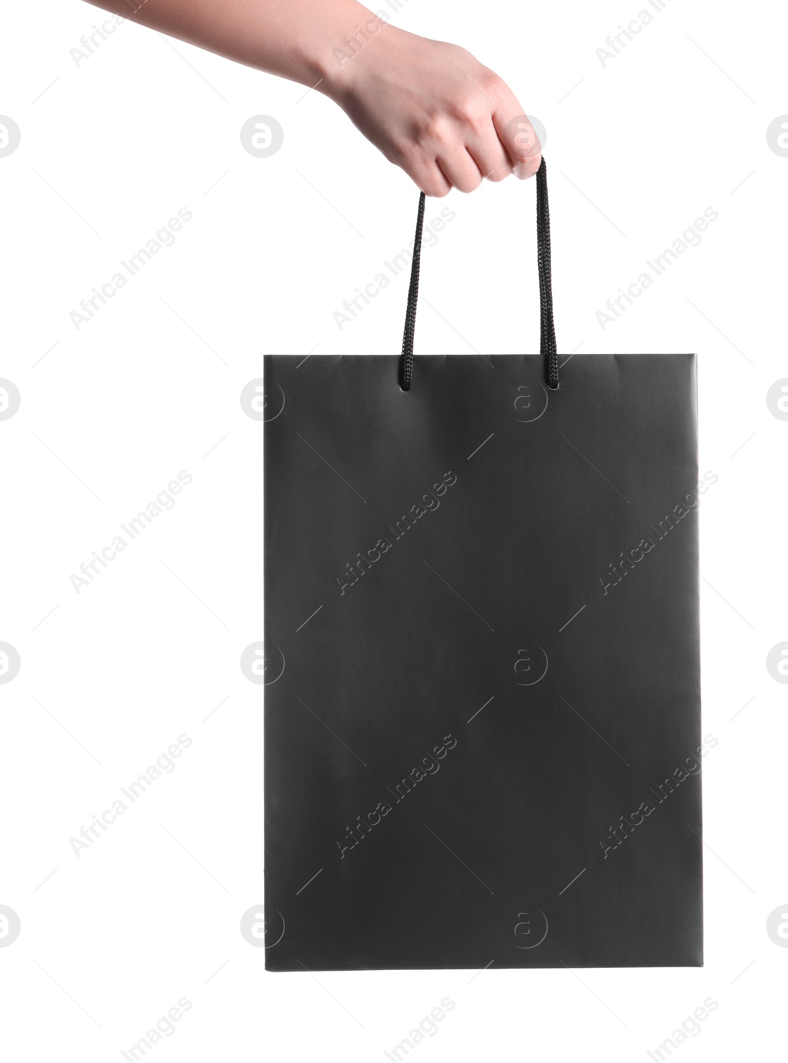 Photo of Woman holding paper shopping bag on white background, closeup