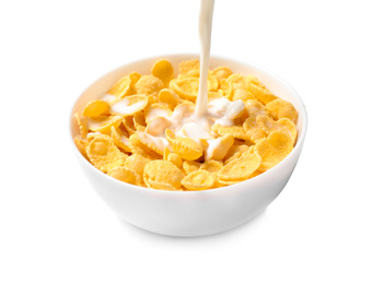 Photo of Pouring milk into bowl with corn flakes on white background