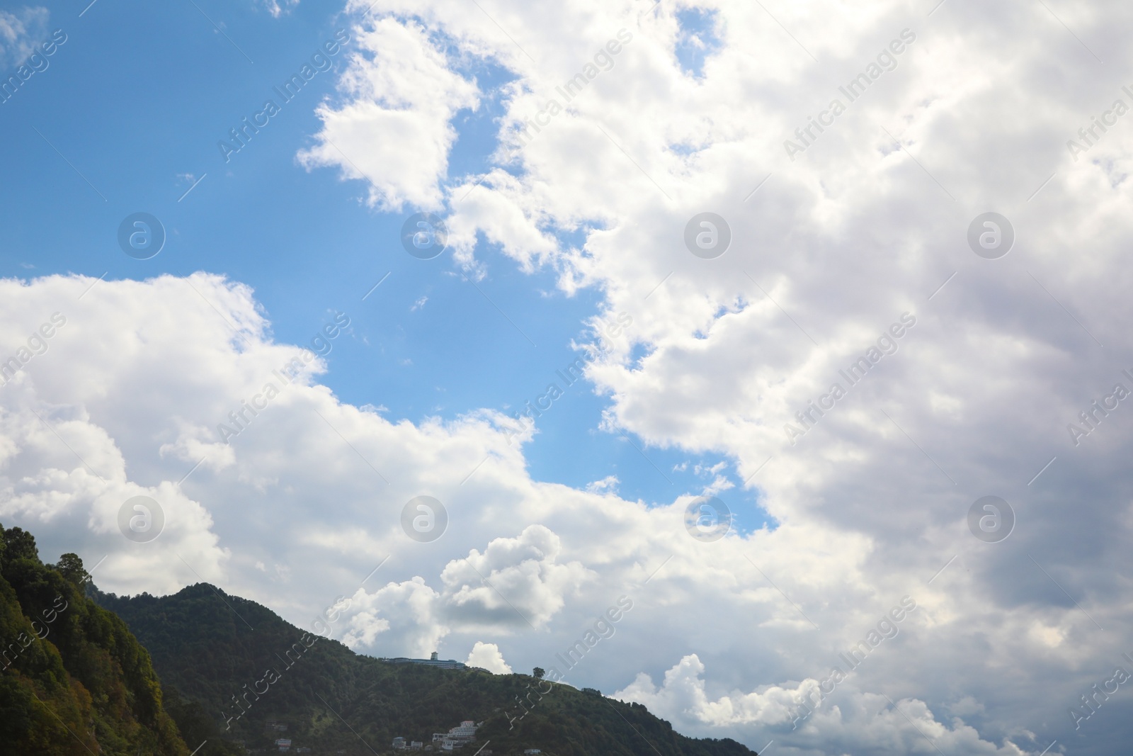 Photo of Picturesque view of mountain under beautiful sky with fluffy clouds