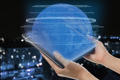 Image of Global network. Woman holding tablet and virtual image of globe with internet connection lines