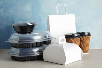 Photo of Various takeout containers on table. Food delivery service