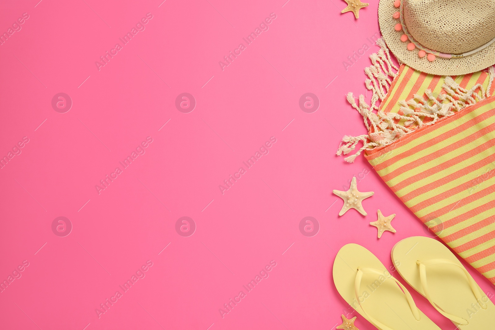 Photo of Flat lay composition with different beach objects on pink background, space for text