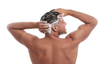 Photo of Man washing hair on white background, back view