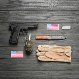 Set of military equipment on wooden background, flat lay