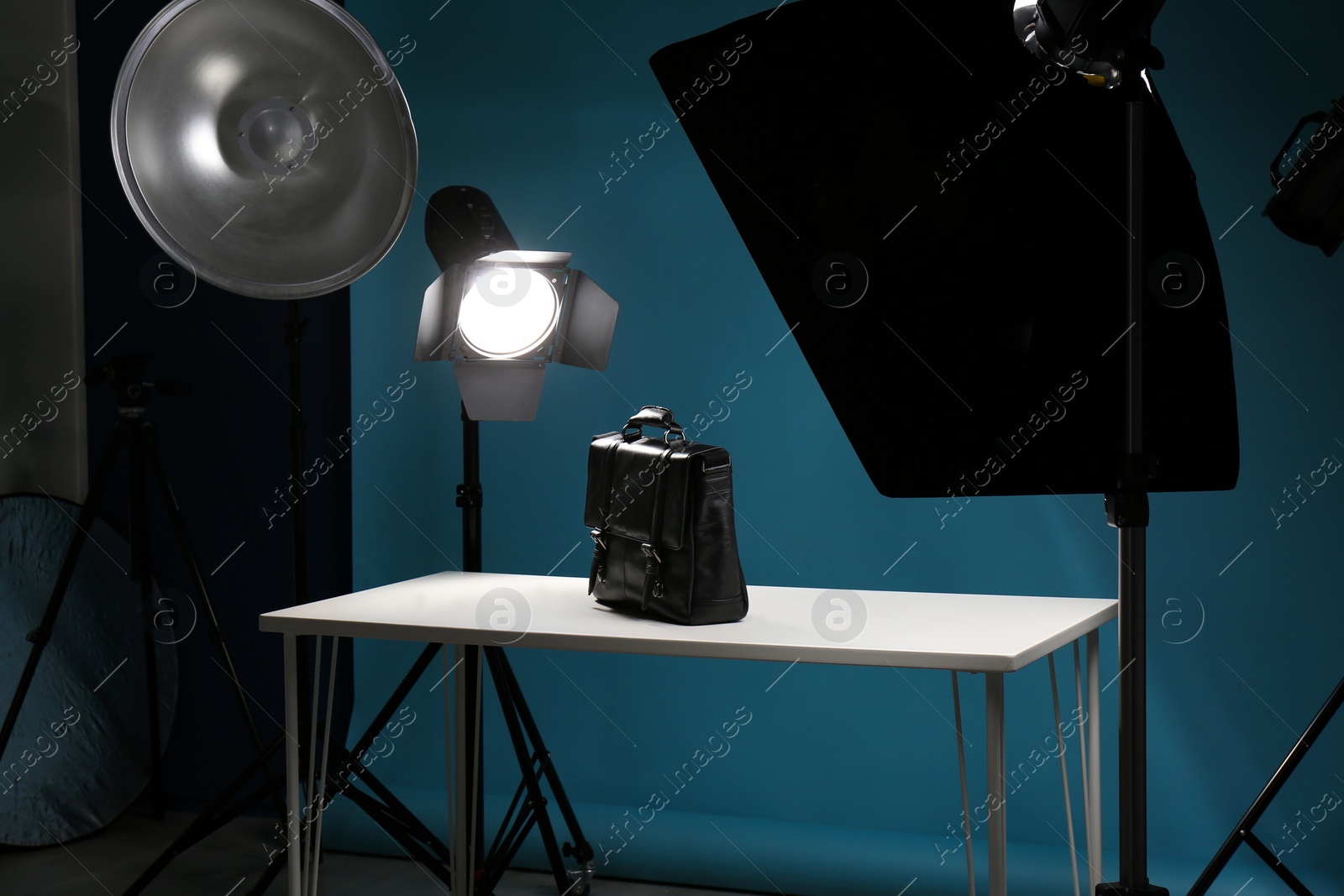 Photo of Shooting of men's bag for product promotion in photo studio