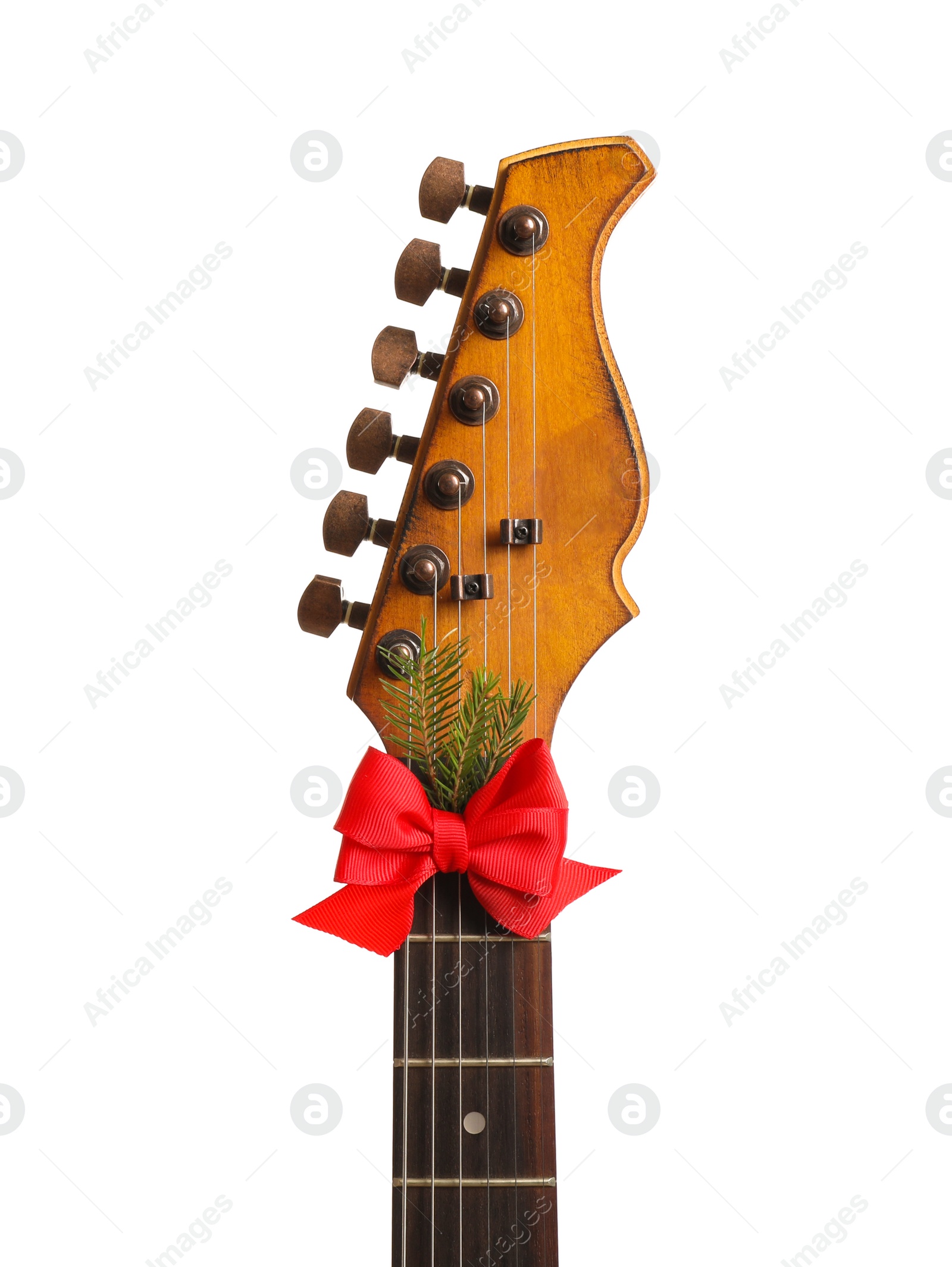 Photo of Guitar with red bow isolated on white. Christmas music concept
