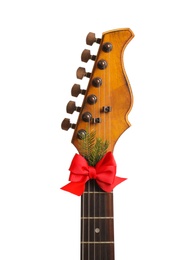 Guitar with red bow isolated on white. Christmas music concept